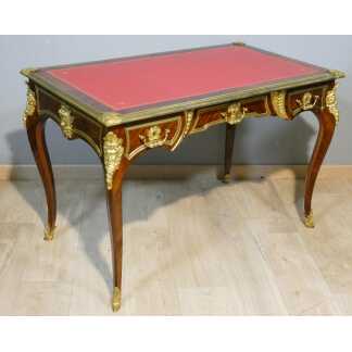 Estampillé Paul Sormani, bureau plat de style Régence en palissandre et bronze doré, XIX ème