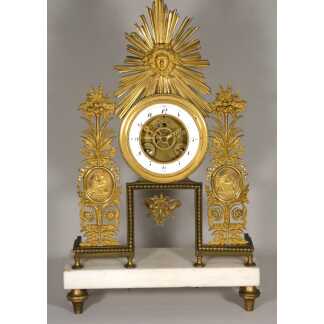 Rare pendule squelette au soleil en bronze doré, signée Deverberie à Paris – Époque Consulat